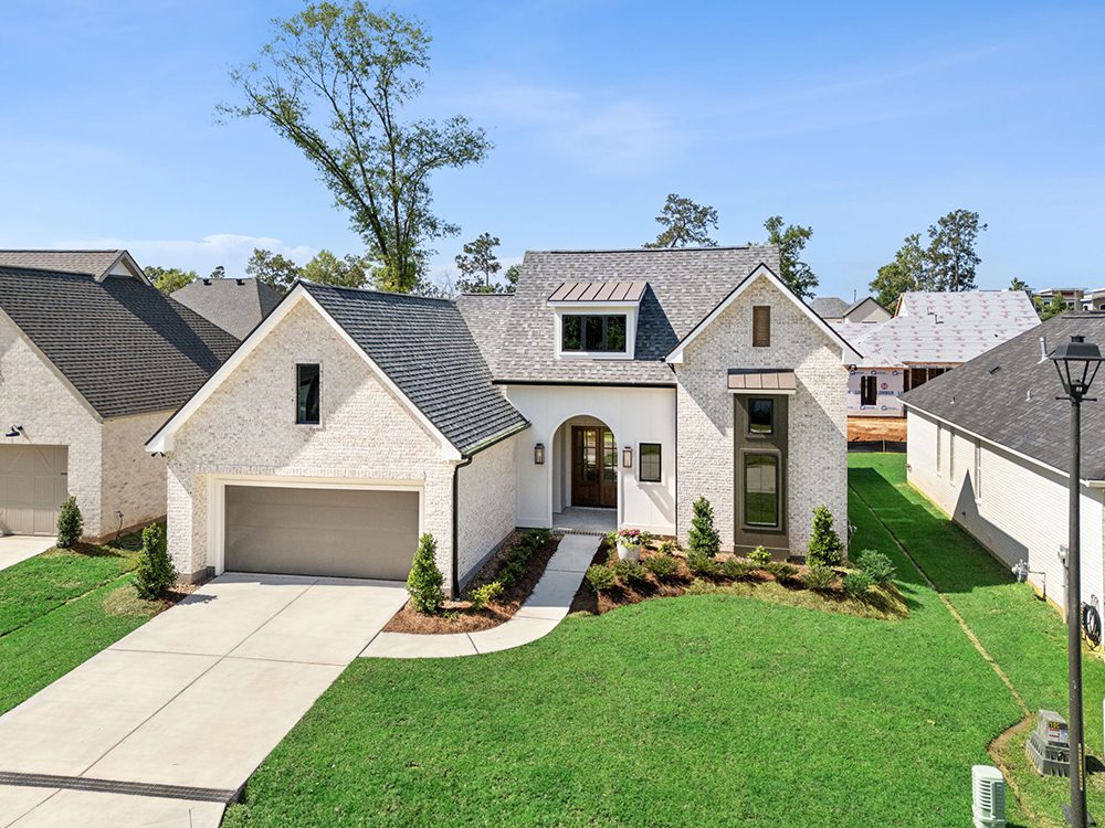 With manicured landscaping, a two-car garage, and a spacious driveway, the home offers both curb appeal and functionality in a beautifully designed neighborhood.