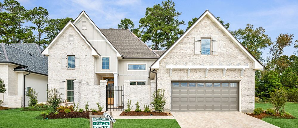 The landscaping highlights the curb appeal of the home.